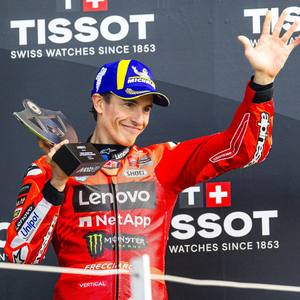 Marc Márquez and the Ducati Lenovo Team on the third step of the podium at Silverstone.